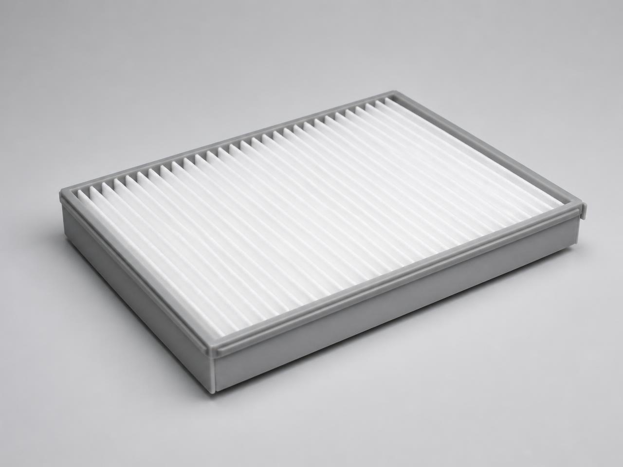 Automotive cabin air filter with white pleated media