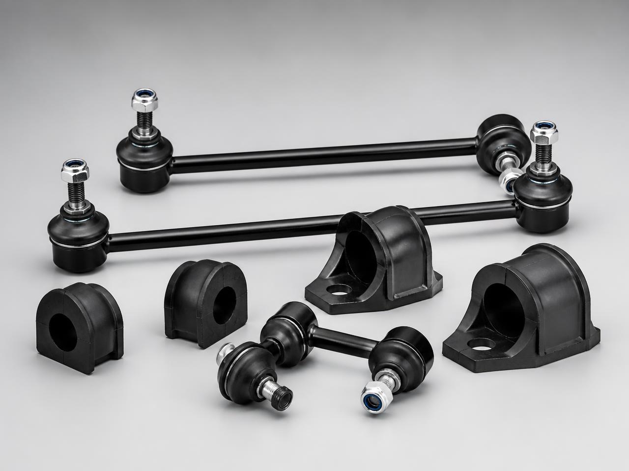 Automotive stabilizer links and rubber suspension bushings